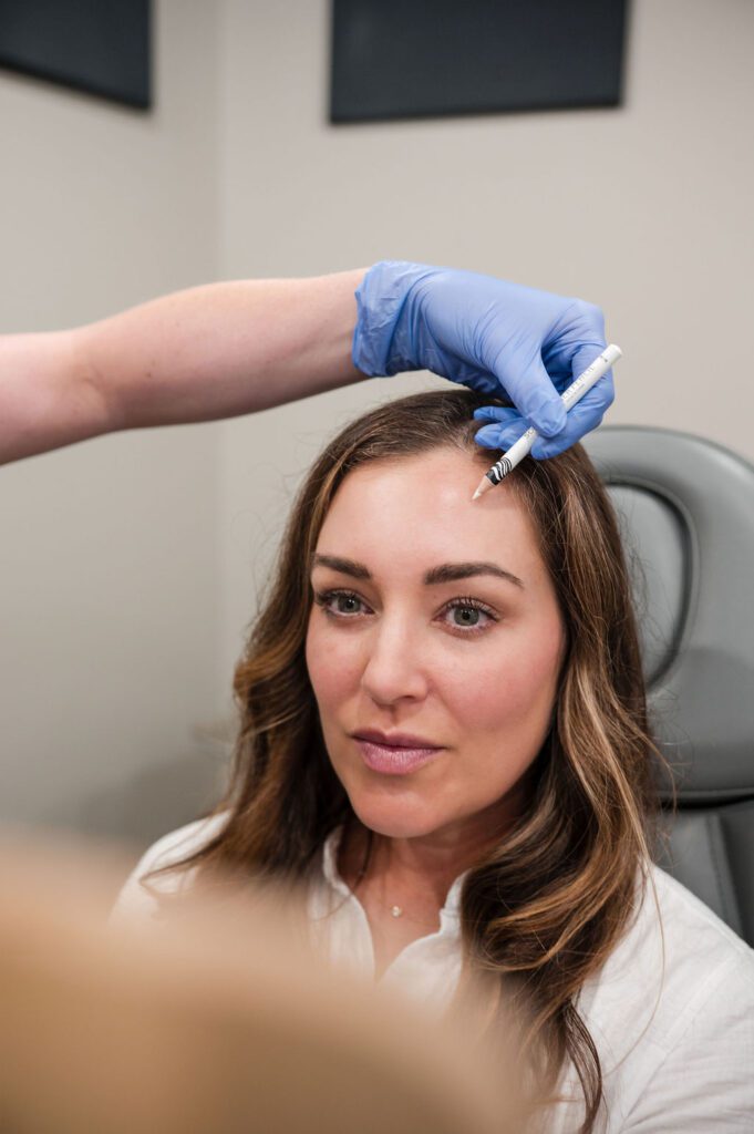 Nurse injector providing aesthetic treatment in Columbus
