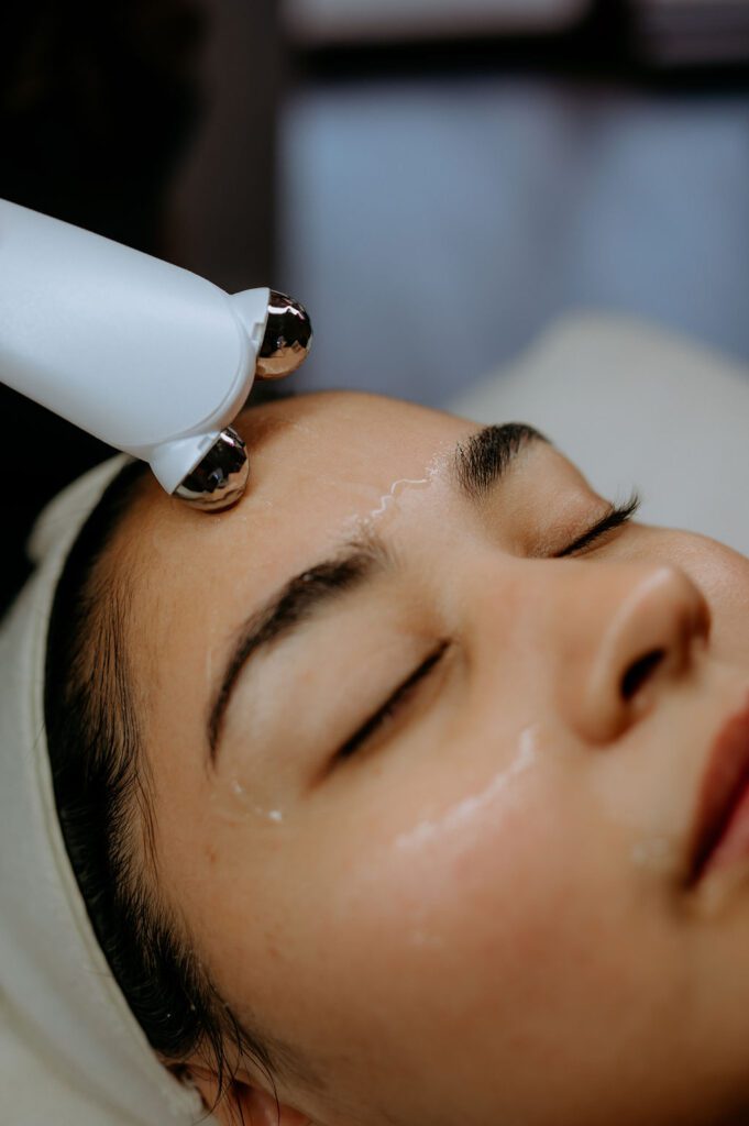 Action shot of esthetician performing a facial treatment