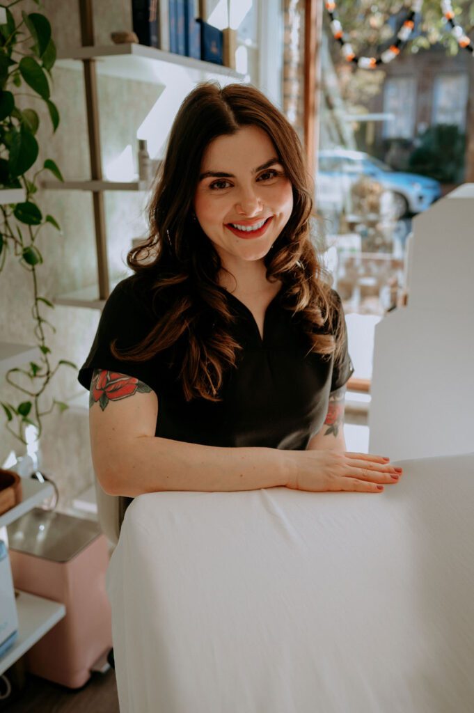 Calming esthetician studio setup with treatment table and products
